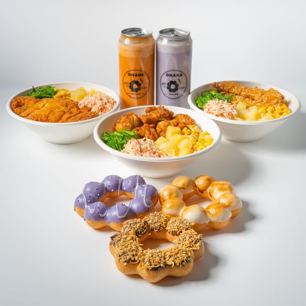 Three bowls of food with fried chicken, seaweed, corn, and pineapple, two canned drinks, and three donuts.
